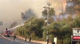 Trees catch fire near houses and residential buildings.