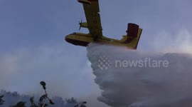 Airplanes drop fire retardant on a forest in Haifa, Israel.