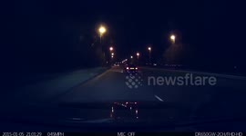 Dash cam - car driving along and bonnet flies open
