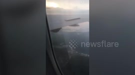 The terrifying moment passengers saw SPARKS pouring mid-air out of a plane's ENGINE.