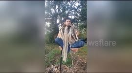 Brazilian activist performs bizarre levitation trick with snakes around his neck
