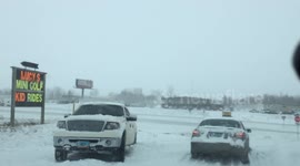 Multiple vehicles stuck in snow during storm