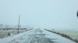 Snow Drifts Covering Road