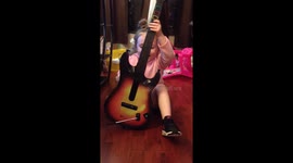 Little girl rockin out.