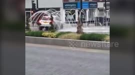 Driver washes car in public fountain - gets chased by police