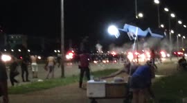 Riot police shoot rubber bullets at student protesters in Brasilia