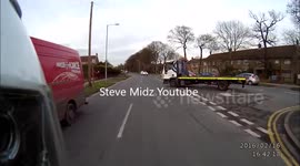 Recovery truck pulls out infront of motorbike