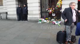 London commuters paying respect to Mandela outside SA embassy London