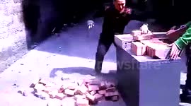Man chops bricks with hands