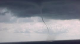 Cruise Ship sails between TORNADO FUNNEL CLOUDS! Close Call!