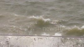 Man swimming in the sea during storm in plymouth