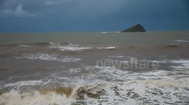 Storms on the devon coast and surfers still risking life for there sport wile emergecy services  looking for a missing boy on the coast