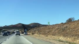 Newsflare Edit - 18-wheeler truck falls off bridge onto California highway