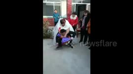 Groom cannot pick up his heavy bride