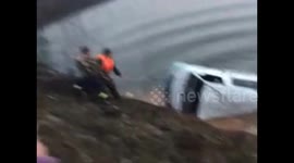 Out-of-control minibus crashes into lake, killing 18