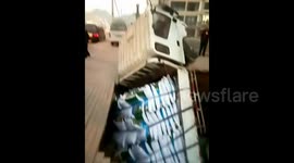 Lorry falls into sinkhole in China
