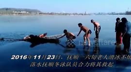 Winter swimmers rescue an elderly man falling into icy lake