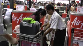 Passengers are apparently allowed to re-pack their bags at a check-in desk in Bangkok