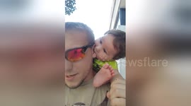 Boy, 1, uses his uncle's ear as a pacifier