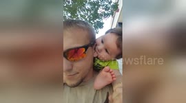 Newsflare Edit - Boy, 1, uses his uncle's ear as a pacifier