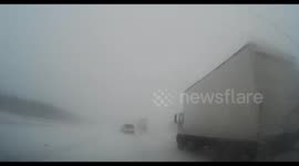 Car has near-miss during blizzard in Canada