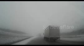 Newsflare Edit - Car has near-miss during blizzard in Canada