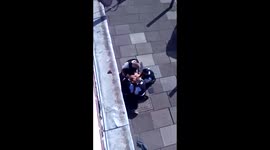 London policeman appears to punch suspect repeatedly on the ground (FULL VERSION)