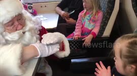 Girl with hearing impairment speaks to Santa through sign language