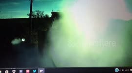 Tractor goes on fire while trying to pull big truck up a steap hil