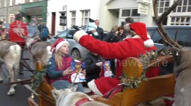 Raw film of Reindeers pulling Santa on sleigh over River Tay into Dunkeld