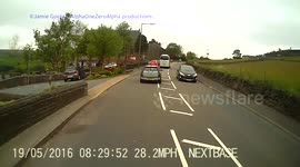 Car over takes a school bus into path of car over cyclist
