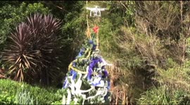 Drone used to put star on top of Christmas tree