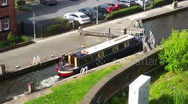 Canal boat smashes through lock