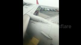 Plane overshoots runway due to ice
