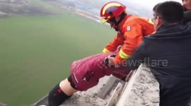 Firefighters in China rescue man from ledge of 30-storey-high building