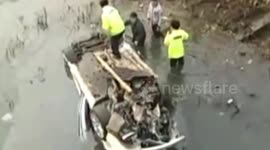 Bentley smashes minibus head-on and rushes into river