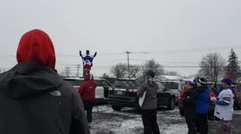 Buffalo Bills fan breaks leg jumping off car