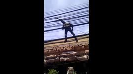 Man walks on electric cables in Thailand