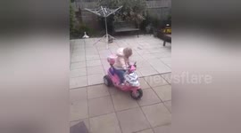 Tired toddler falls asleep on moving toy car