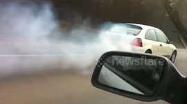 Man driving on motorway with car almost on fire!