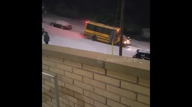 School bus crashes on snow-covered hill