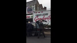 Boris Johnson struggles to fit large Christmas tree into his car