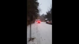 Mini Cooper crashes into parked car after trying to climb icy hill