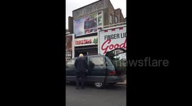 Newsflare Edit - Boris Johnson struggles to fit large Christmas tree into his car