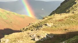 Tornado jet passes through rainbow