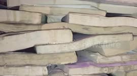 Cafe owner builds massive 'well' out of books