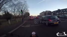 Angry motorist confronts motorcyclist on UK road