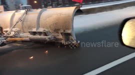 Snow plough vehicle causes sparks to fly on road in Quebec, Canada