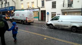 Pedestrians shelter from intense Hailstorm
