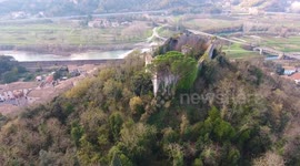 Aerial shot, medieval ruins on the hill, overcast weather, Europe, filmed with drone